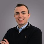 Das lvh-Team Porträt eines lächelnden jungen Mannes vor grauem Hintergrund