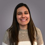 Das lvh-Team Porträt einer lächelnden Frau mit braunen Haaren vor grauem Hintergrund