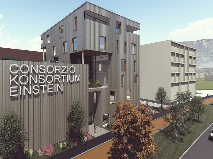 Ansiedlungen und Gewerbeflächen Modernes Gebäude mit der Aufschrift Konsortium Einstein und Bäumen entlang des Gehwegs