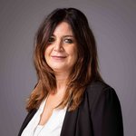 Das lvh-Team Porträt einer lächelnden Frau mit braunen Haaren und schwarzem Blazer